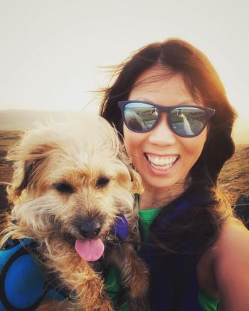 Partnerships Manager, Marie Cheng and her dog Millie on Higger Tor in the Peak District